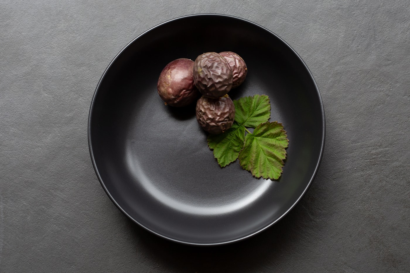 Figs on a dark plate.